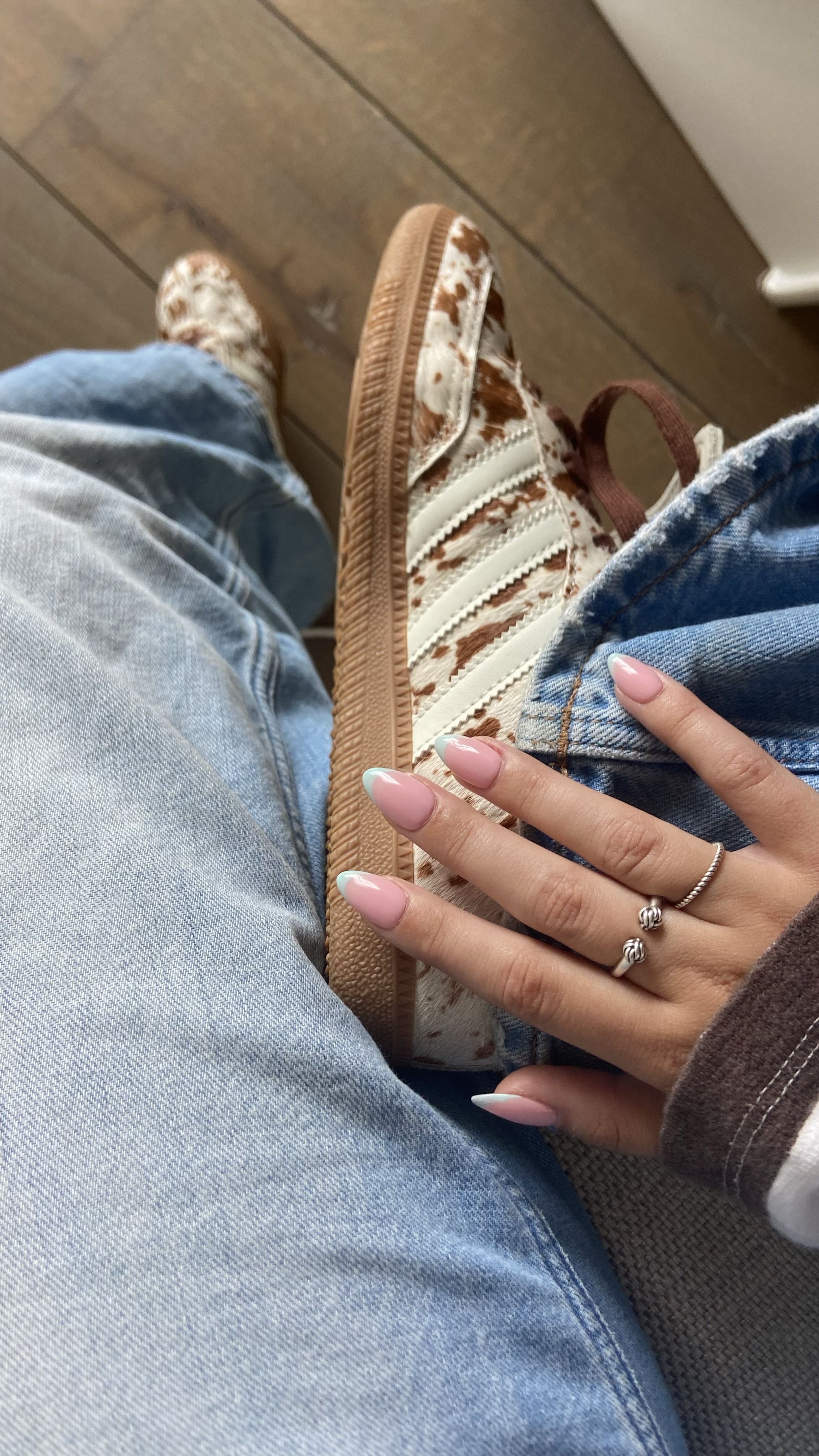 Hand with soft pink ombré almond nails